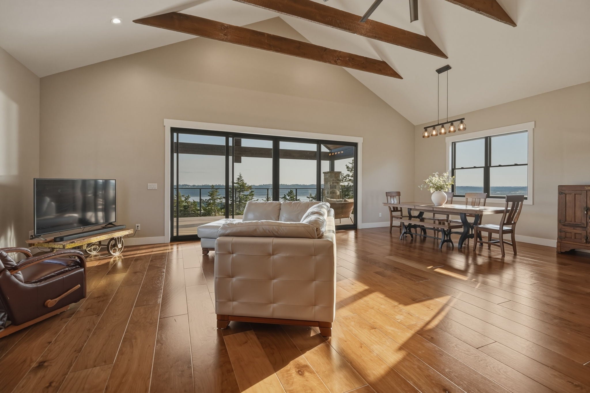 Living room with vaulted wood ceiling and valley view