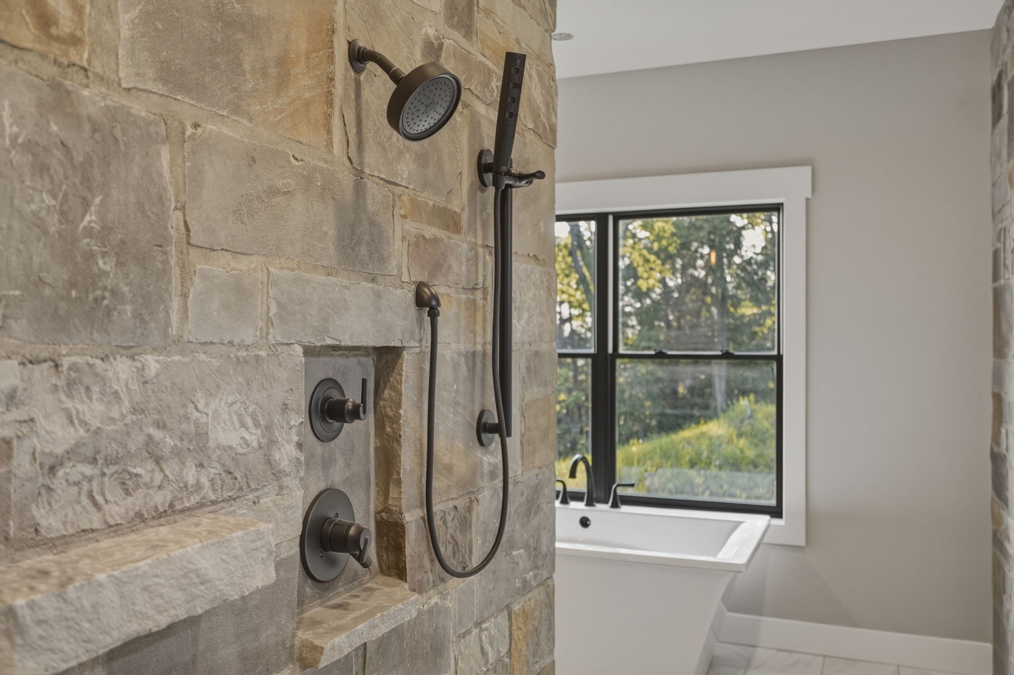 Primary bath walk-in stone tile shower